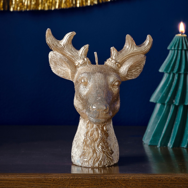 Golden deer motif candle